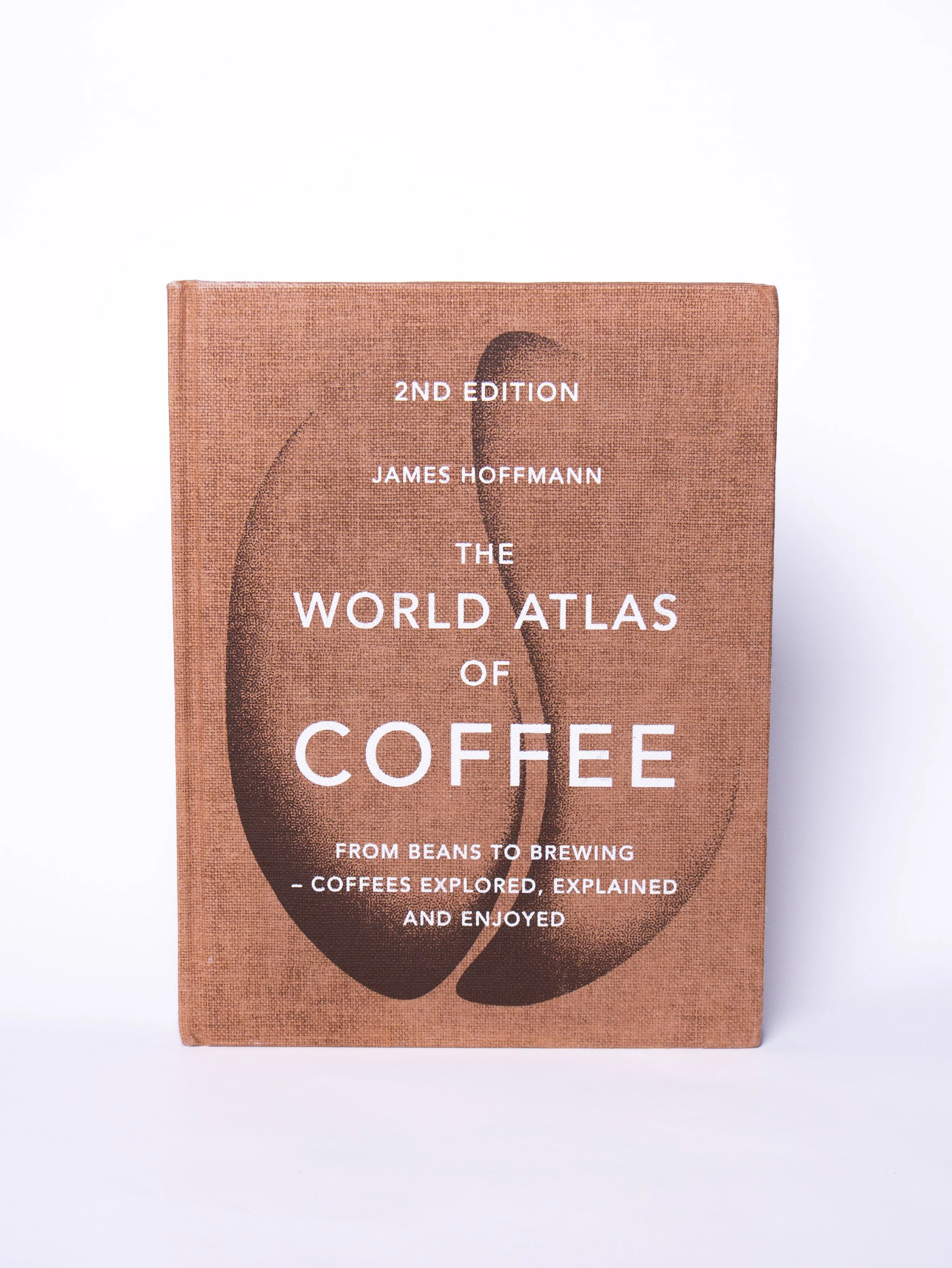A hardcover book titled "The World Atlas of Coffee" by James Hoffmann, 2nd edition, against a plain white background.