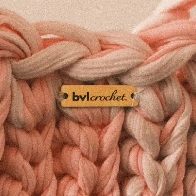 Close-up of thick, braided yarn with a small label reading 'blv crochet'