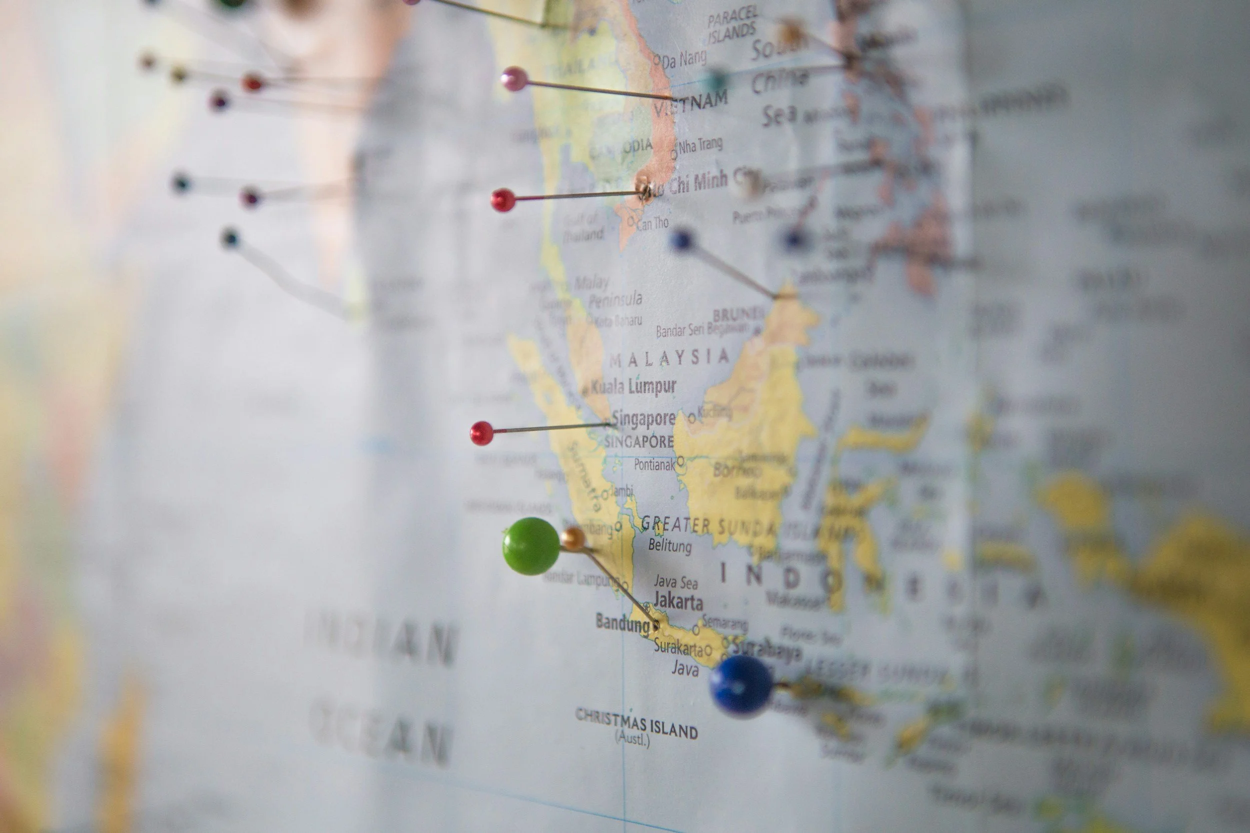 A world map with colorful pins marking locations across Asia, including Vietnam, Thailand, Malaysia, Singapore, and Indonesia, with a focus on Vietnam.