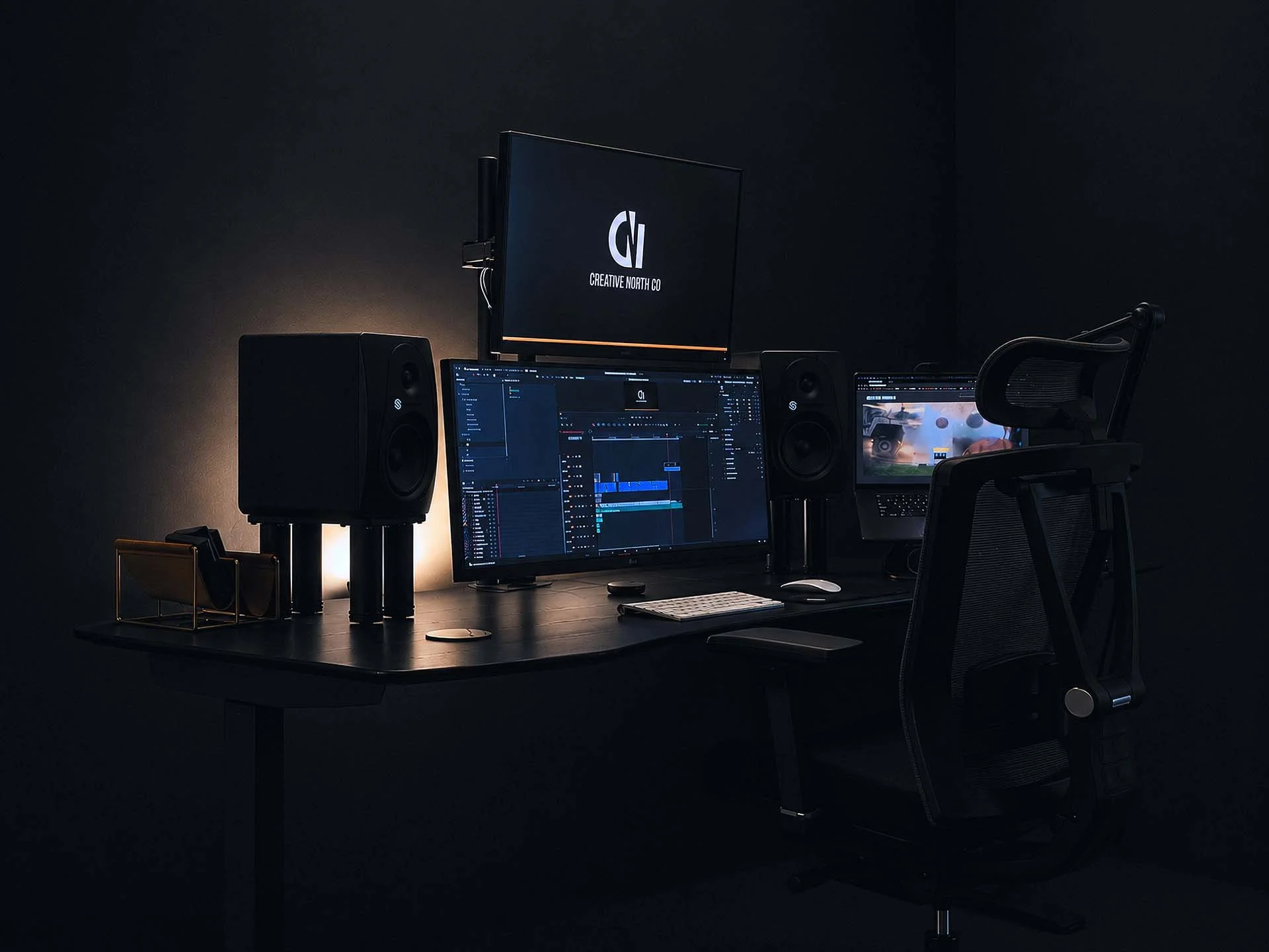 Dark workspace with computer monitors displaying digital audio editing software, studio speakers, an ergonomic office chair, and a minimalist desk lamp, in a dimly lit room.
