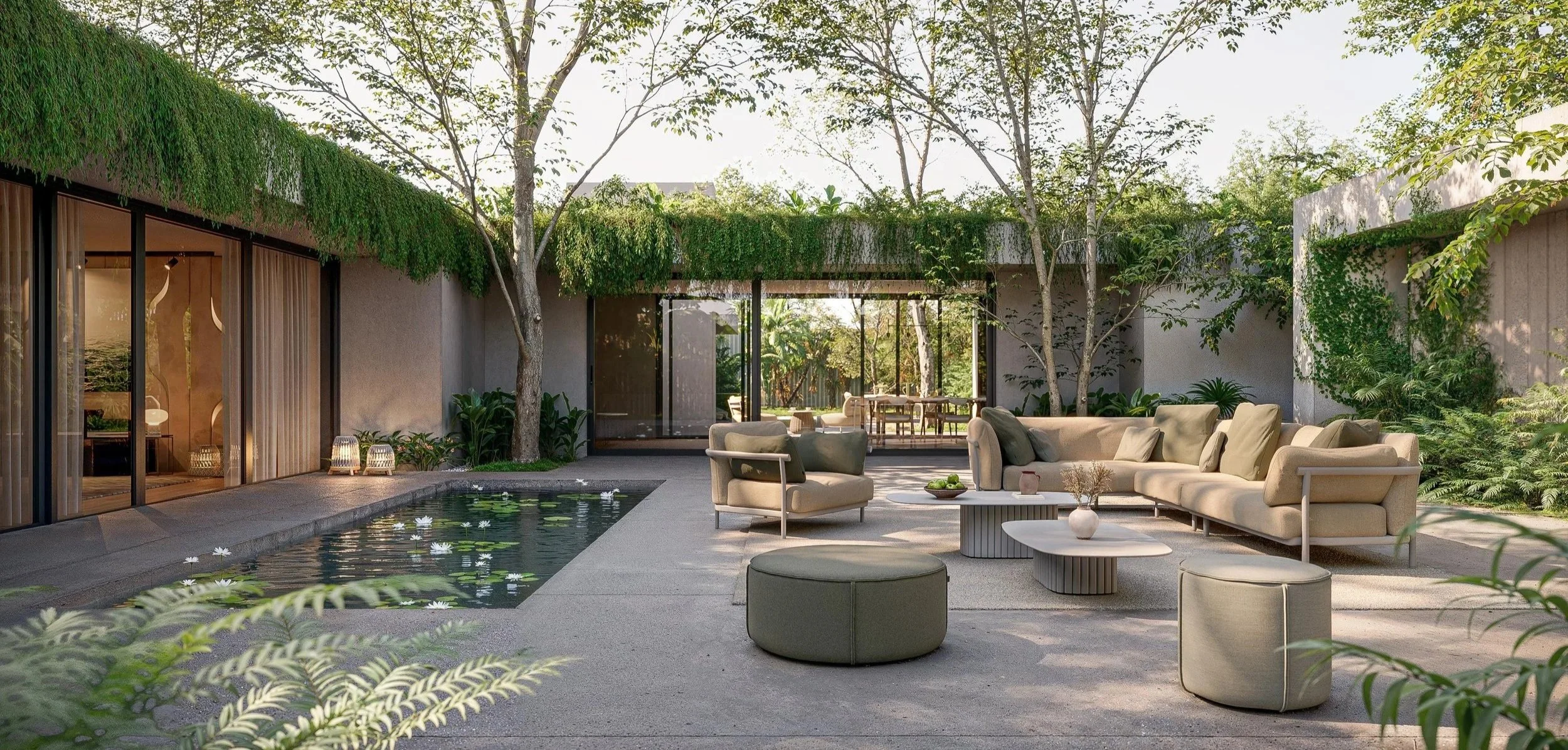 Modern outdoor patio with beige seating, a small pool with water lilies, surrounded by greenery and trees, large glass sliding doors, and a garden in the background.