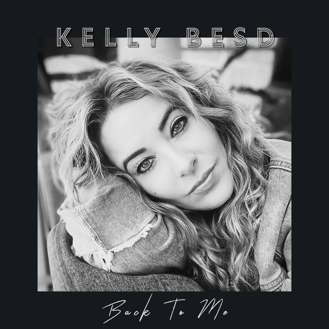 Black and white album artwork of Kelly Besd with curly hair resting her head on her arm, with text 'KELLY BESD' at the top and 'Back To Me' at the bottom.