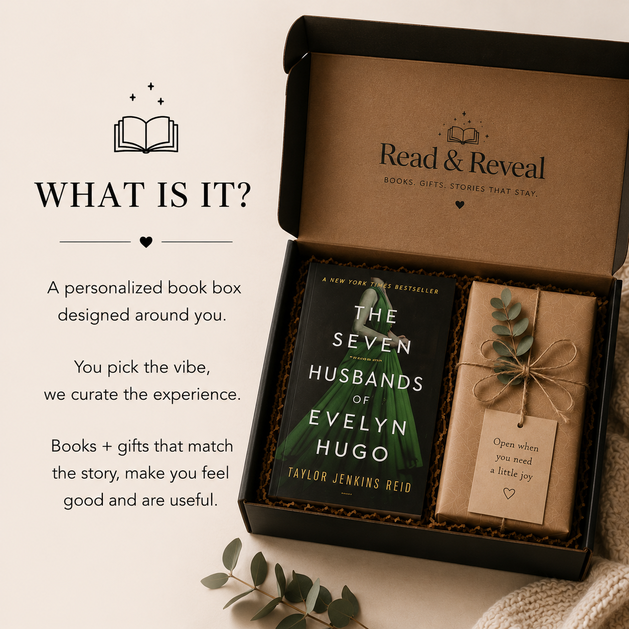 A personalized book box containing a copy of the novel 'The Seven Husbands of Evelyn Hugo' by Taylor Jenkins Reid and a wrapped gift with a tag that says 'Open when you need a little joy,' presented by Read & Reveal with books and gifts curated to match the reader's story.