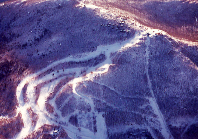 Aerial view of Dutchess Ski Area, showing cottages near summit, c. 1968.