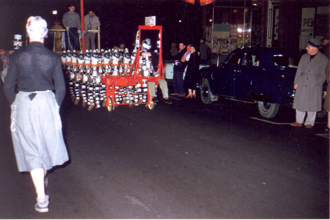 Mohurter's Tin Men float in Halloween parade on Main Street in the 1950s