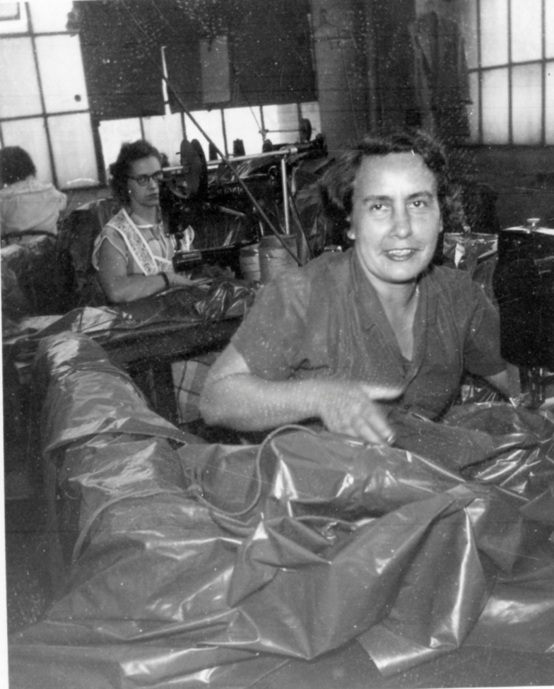Anna Tomanic sews a poncho at Bobrich, 1952