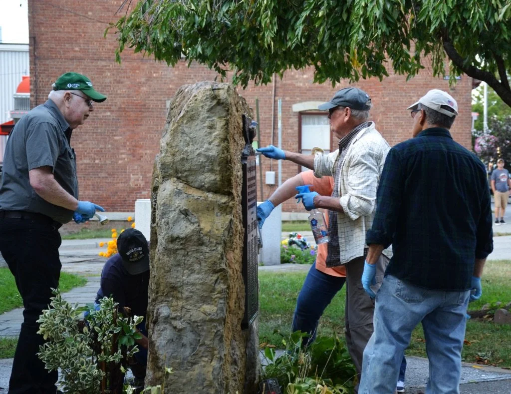 Volunteers cleaning War Memorial Monument.jpeg