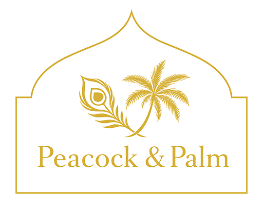 Logo with a peacock feather and a palm tree, with the text "Peacock & Palm"