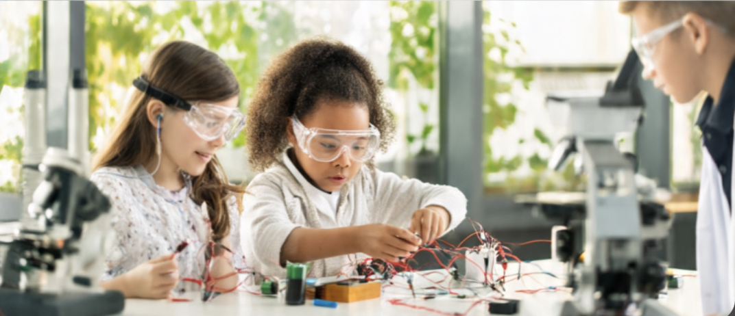 Kids performing experiment with wires
