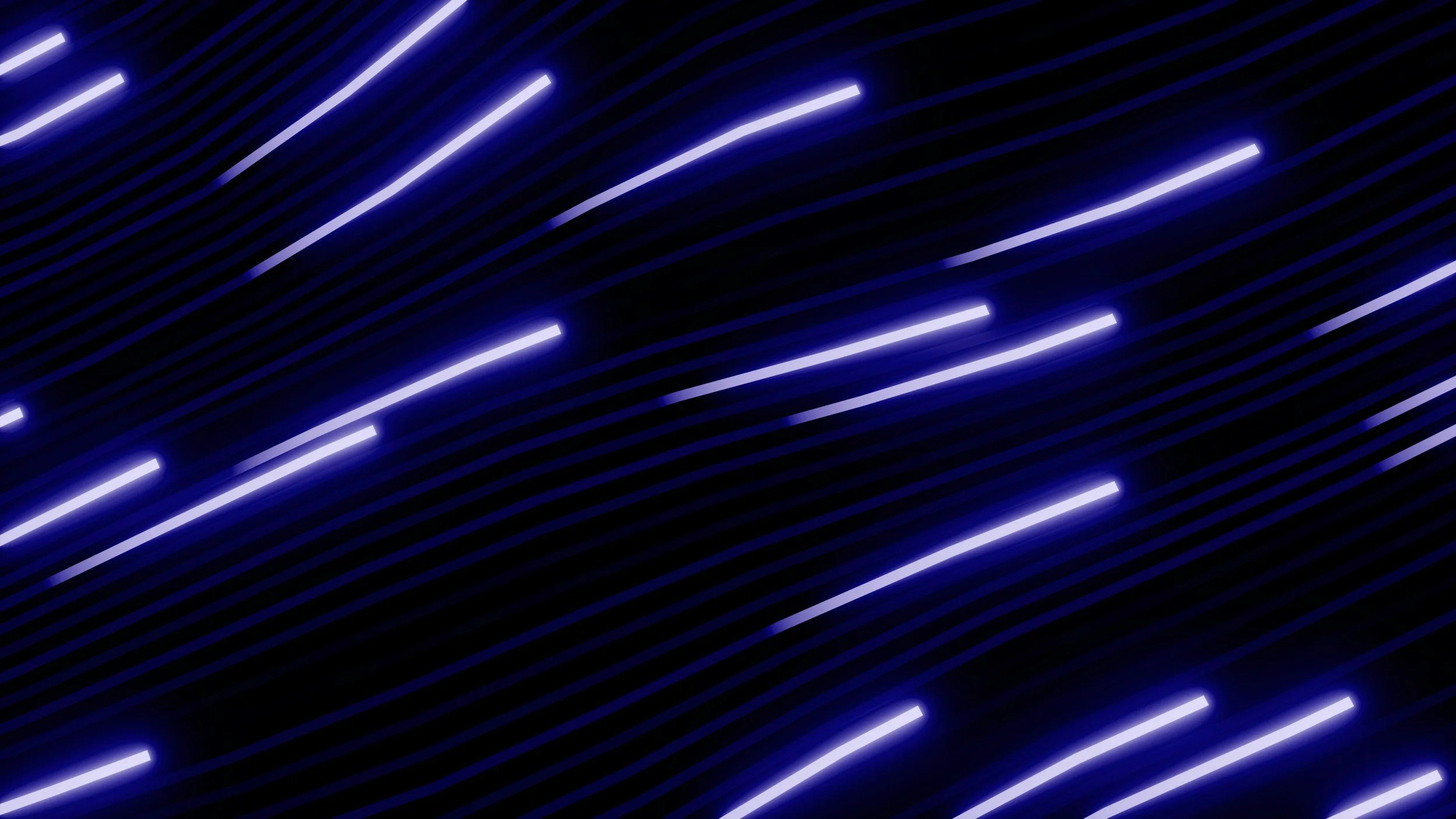 Blue and purple diagonal streaks of light on a dark background, creating a dynamic abstract pattern.