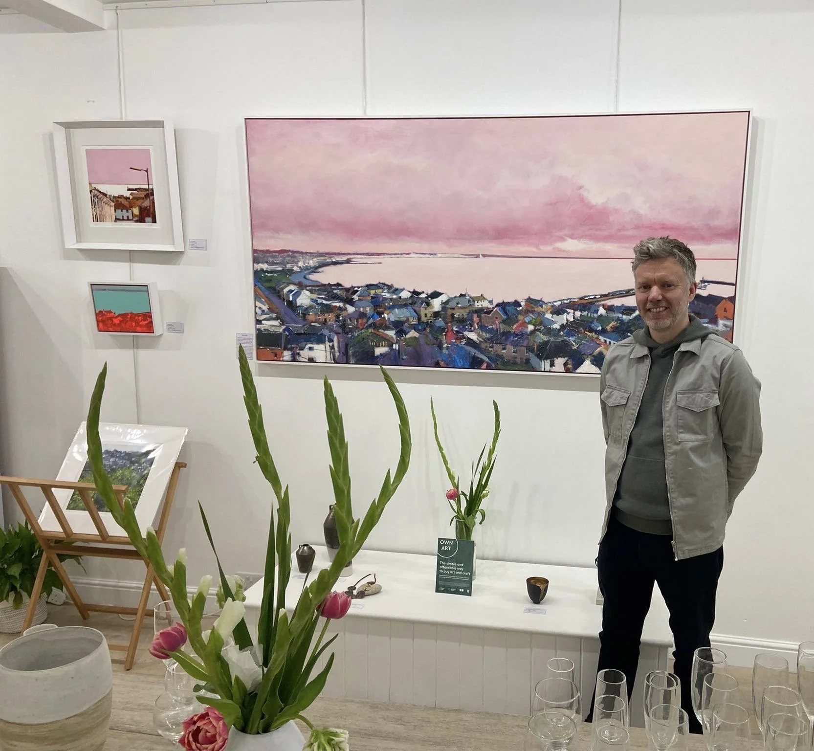 Steven Platt in front of his painting, Mounts Bay at the opening night of the mixed exhibition at The Summerhouse Gallery in Marazion, Cornwall