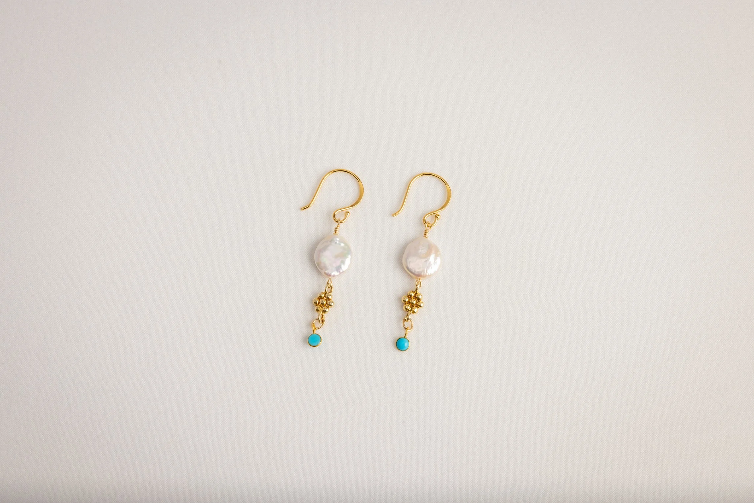 Freshwater coin pearls with bezeled turquoise accents on gold earwires
