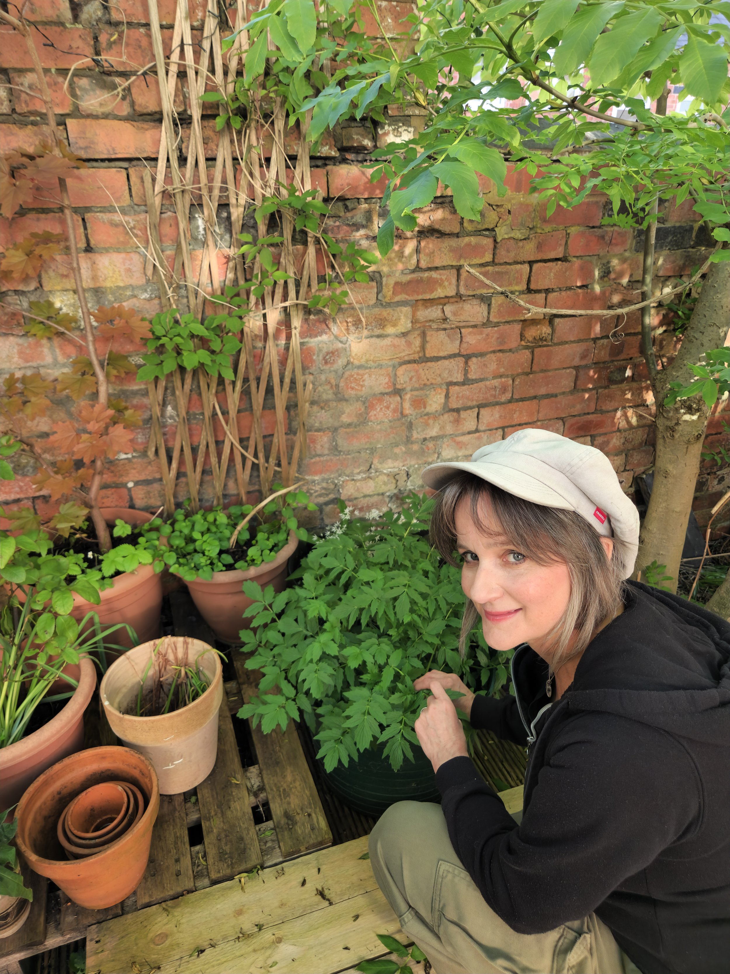 Sarah Oakley Wallis, medical herbalist and clinical psychologist, in a garden in Sheffield.