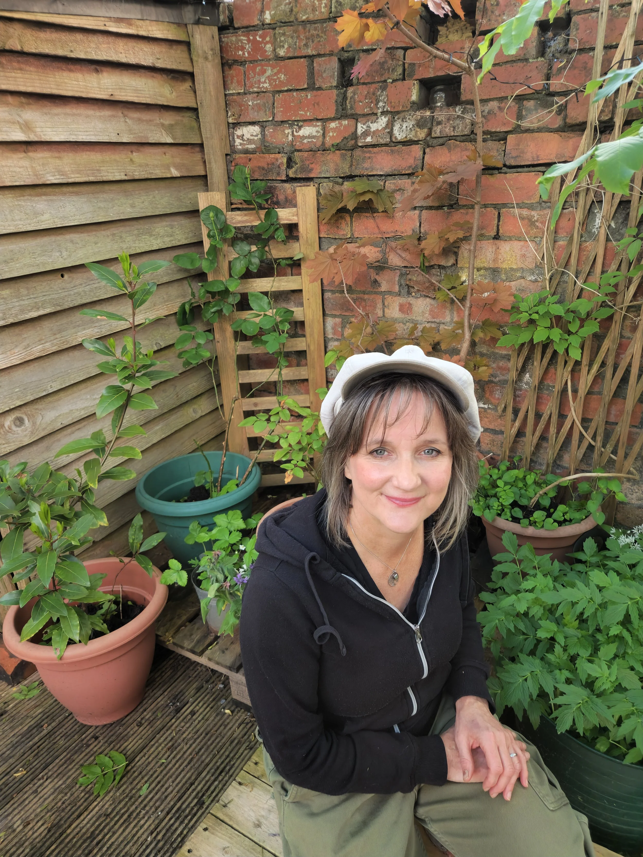 Sarah Oakley Wallis,  medical herbalist and clinical psychologist, in a garden in Sheffield.