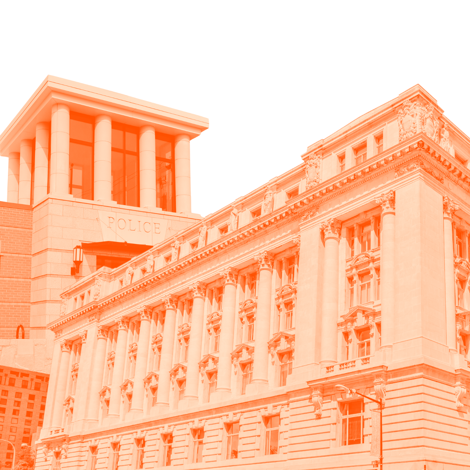Photograph of a historic governmental building with ornate architectural details, columns, and a prominent police station sign, under a clear sky.