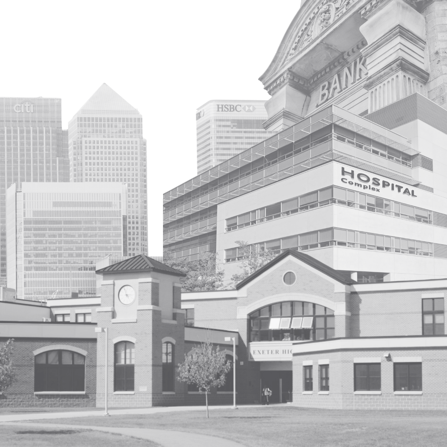 Photo of a cityscape with modern high-rise buildings, a hospital complex, and a historic brick building with a clock and sign that reads Exeter HIC in the foreground.