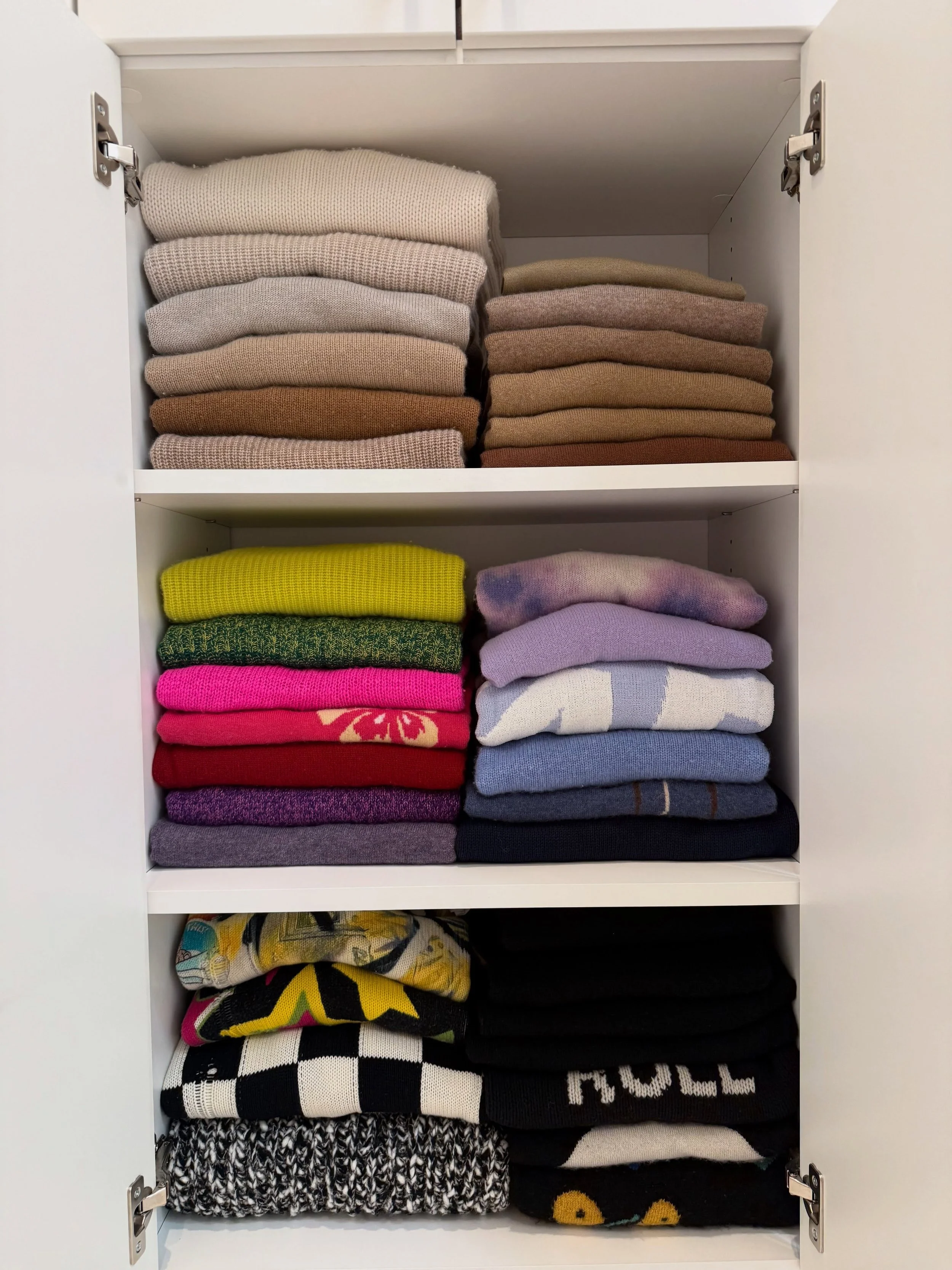 a place for everything, and a little more intention behind how it&rsquo;s kept.

closet cabinets organized by color, fabric, and style&mdash;moving from light to dark while grouping like pieces together. cardigans with cardigans, crews with crews, an
