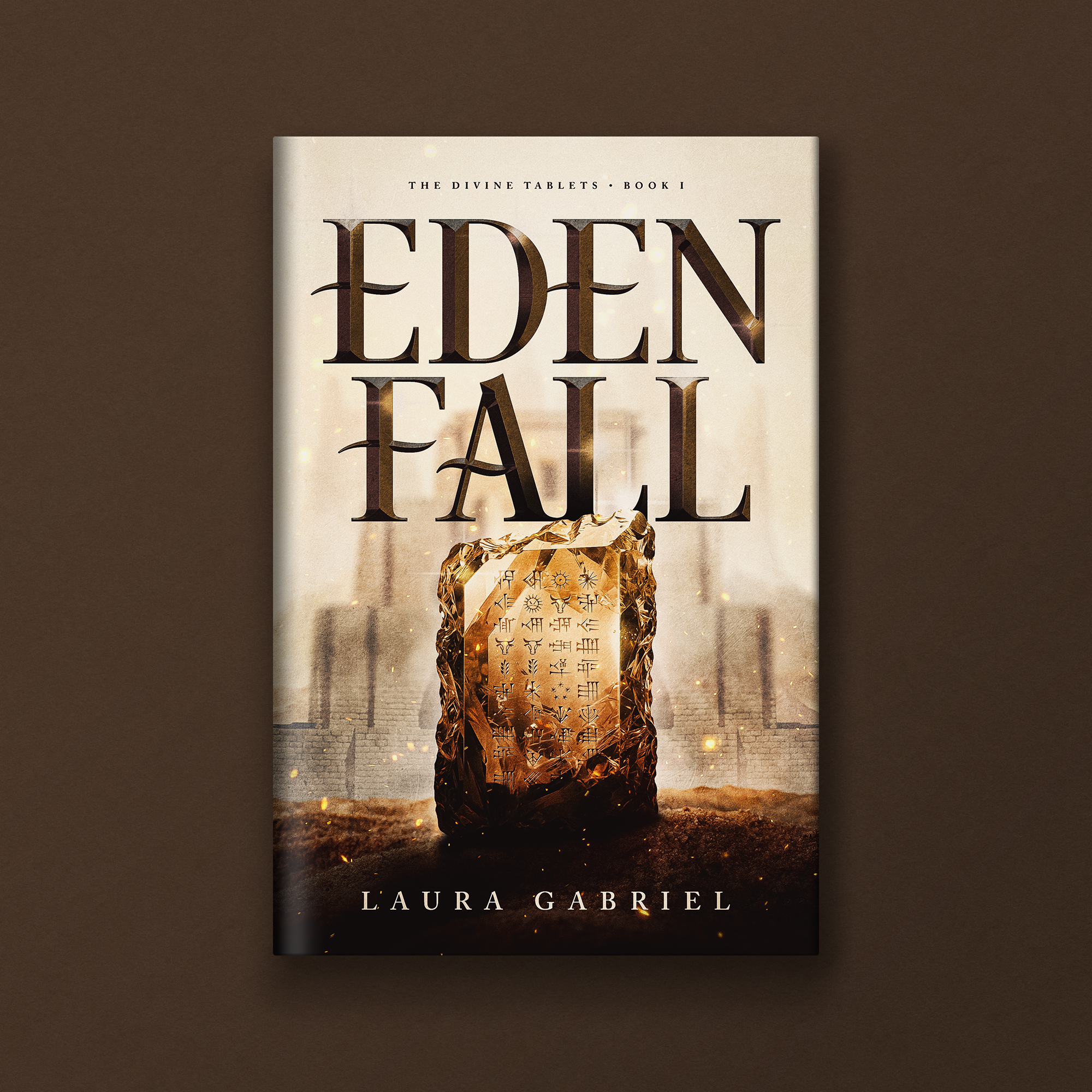 Book cover titled 'The Divine Tablets, Book I' by Laura Gabriel featuring an ancient tablet with symbols and glowing effects.