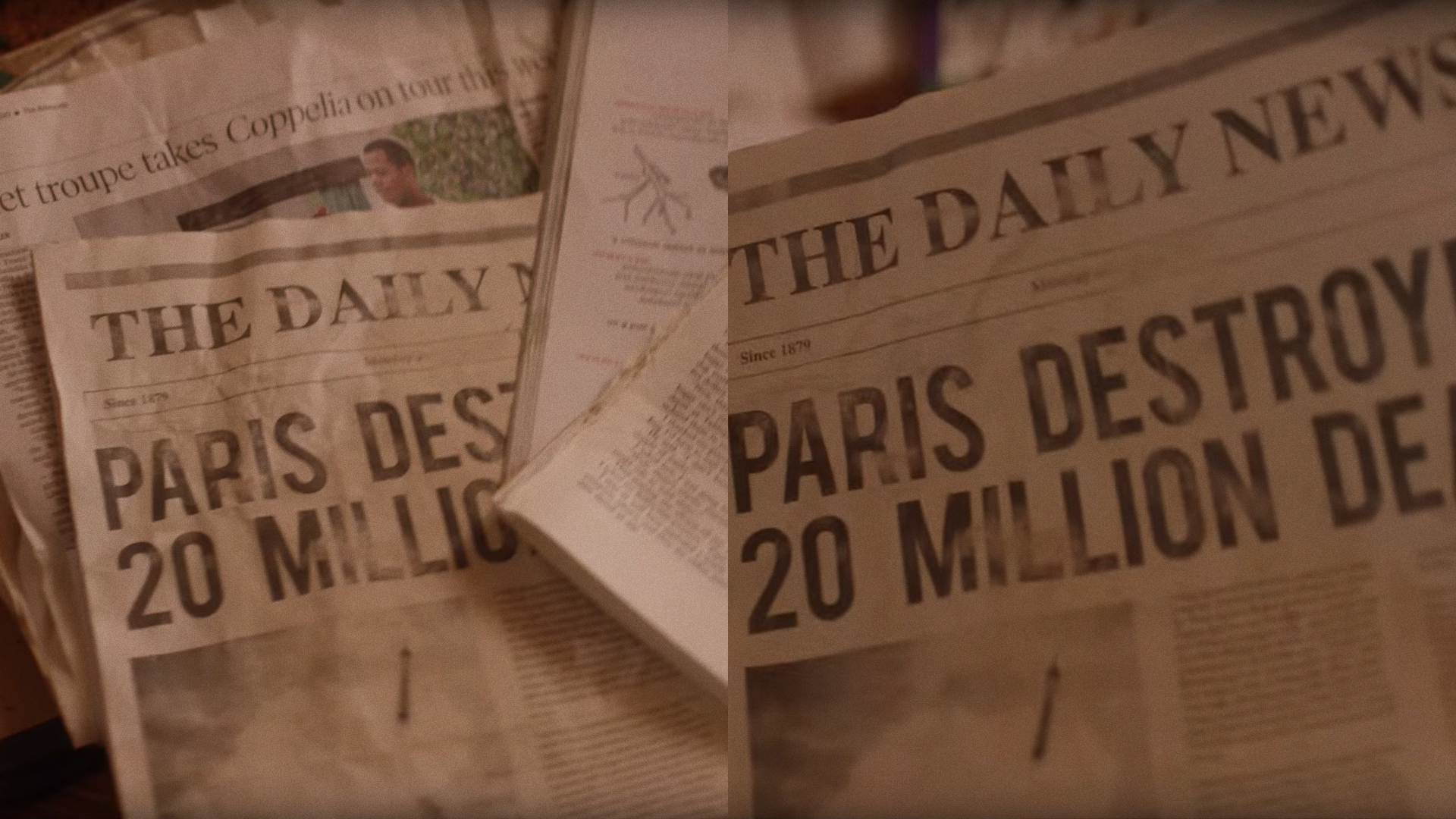 Several copies of a newspaper titled 'The Daily News' with headlines about Paris destruction and a person in a garden, spread on a wooden surface.