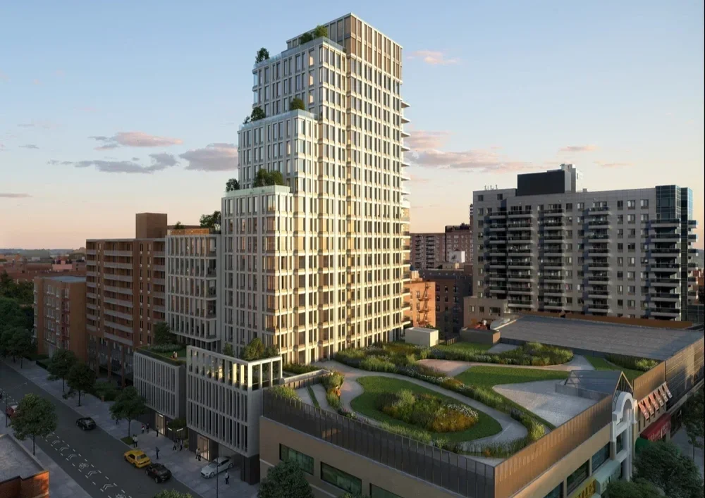 A tall modern residential building with multiple tiers, green rooftop terraces, and landscaped outdoor areas in an urban setting during sunset.