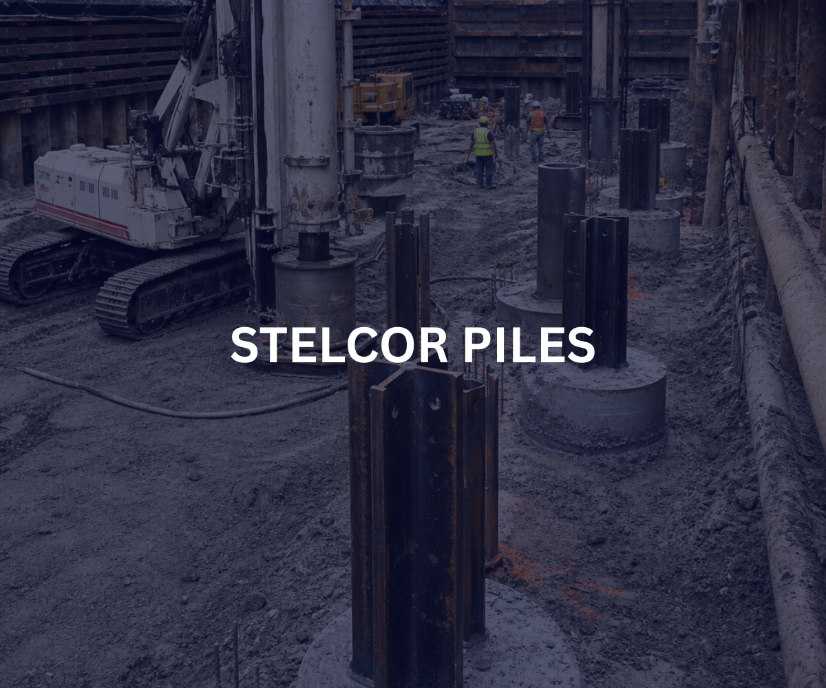 Construction site with steelcore piles and construction workers in safety vests and helmets, heavy machinery, and large steel piles embedded in the ground.