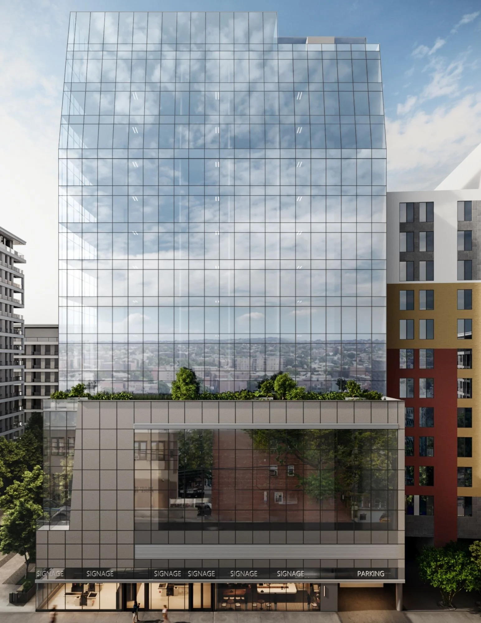A modern multi-story office building with glass exterior reflecting the sky and surrounding buildings. The ground floor has retail space with signage for parking and other businesses, and people are walking on the sidewalk in front of the building.
