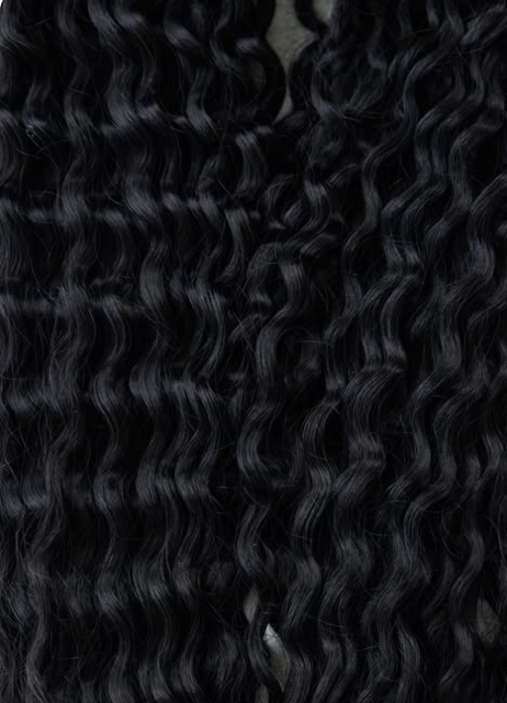 Close-up of long, curly black hair.