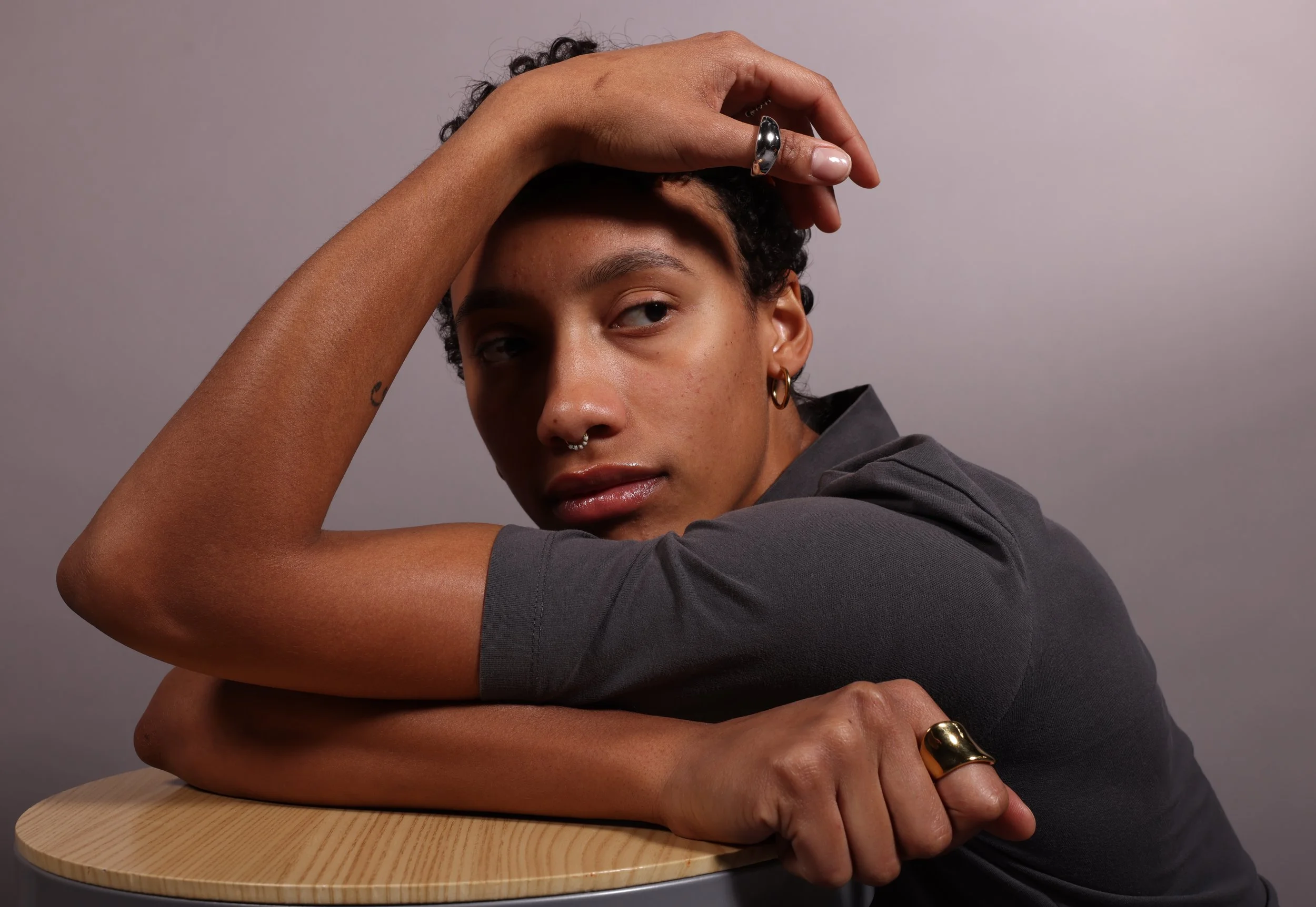 Isabella Sokolova, 23, ponders her future behind the camera at Lee Hills Hall photo studio in Columbia, Mo., on March 31, 2026. Sokolova left a track and field career behind and is now racing towards a different finish line. "Right now, I'm most look
