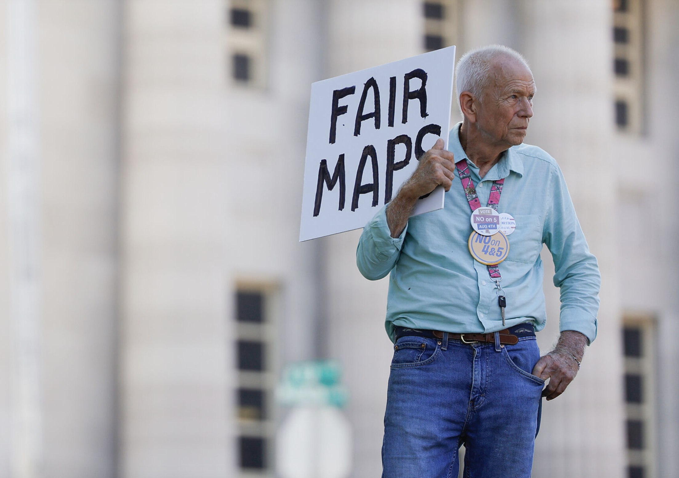 Steve Perry looks at the rallying crowd on Aug. 31 at the Missouri Supreme Court Building in Jefferson City. Respect MO Voters, People Not Politicians and Missouri Faith Voices were a few of the groups present at the protest.