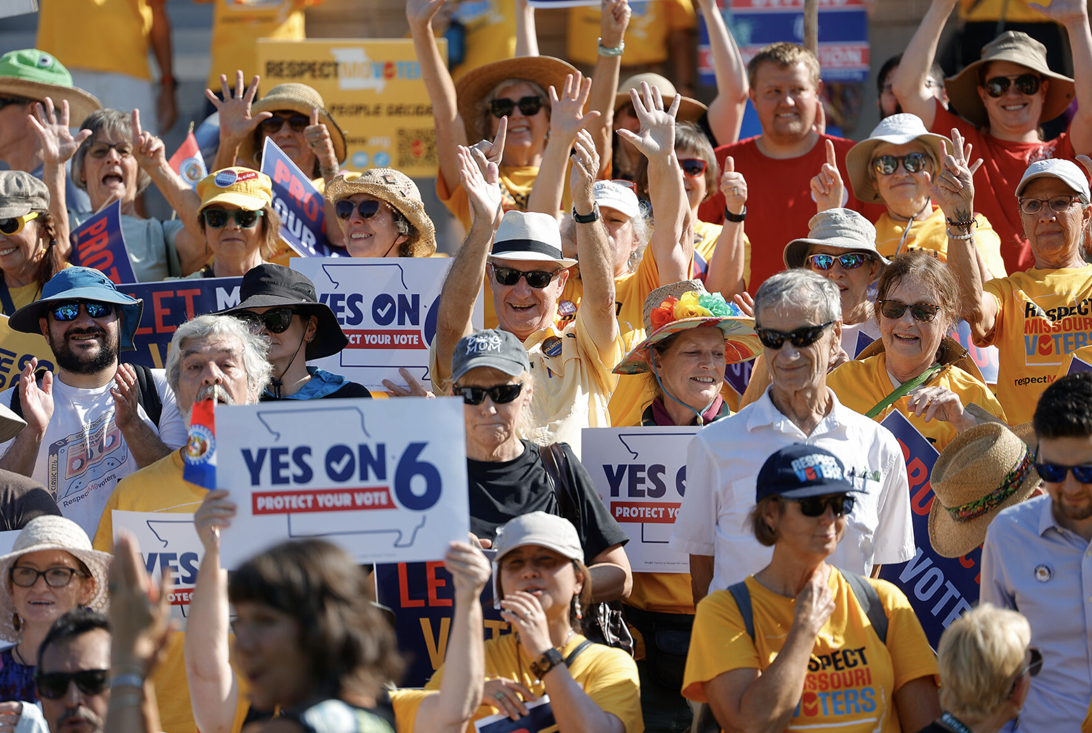 Mark Abels claps after a group photograph on Aug. 31 at the Missouri Supreme Court Building in Jefferson City. Abels volunteers for Respect MO Voters, a campaign to pass Amendment 6.