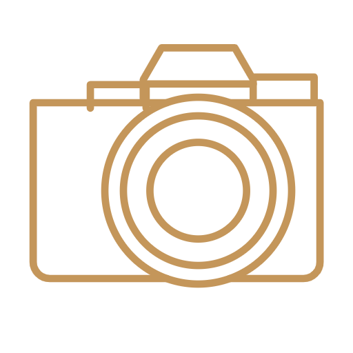 Icon of a camera with a lens in the center.