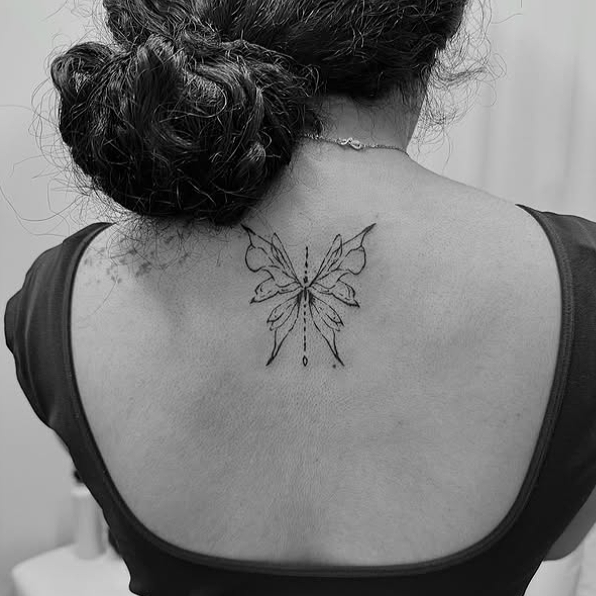 Fine Line Tattoo - ornamental butterfly spine tattoo
