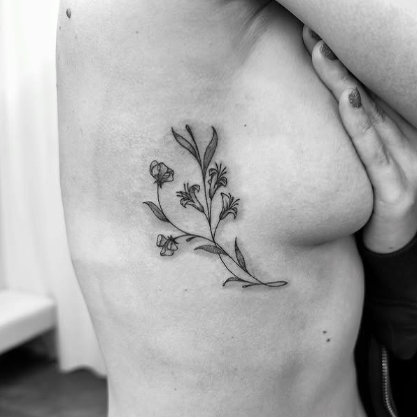 Fine Line Tattoo - floral rib tattoo