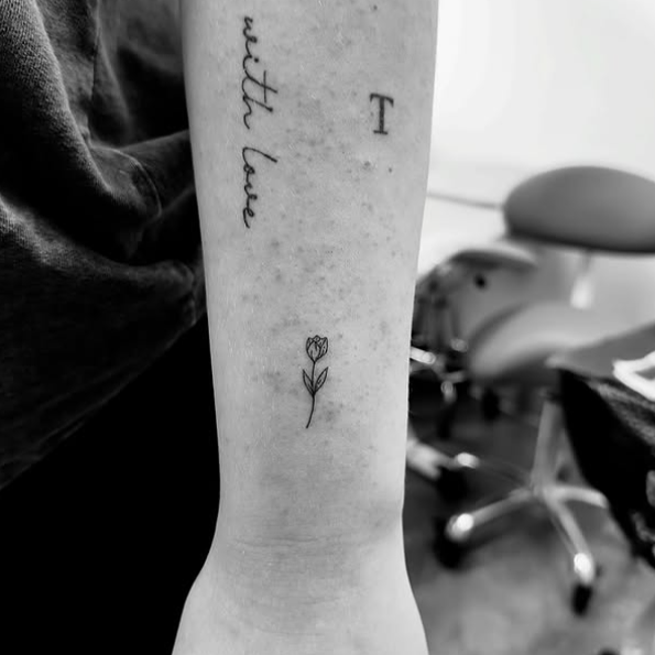 Fine Line Tattoo - tiny flower tattoo