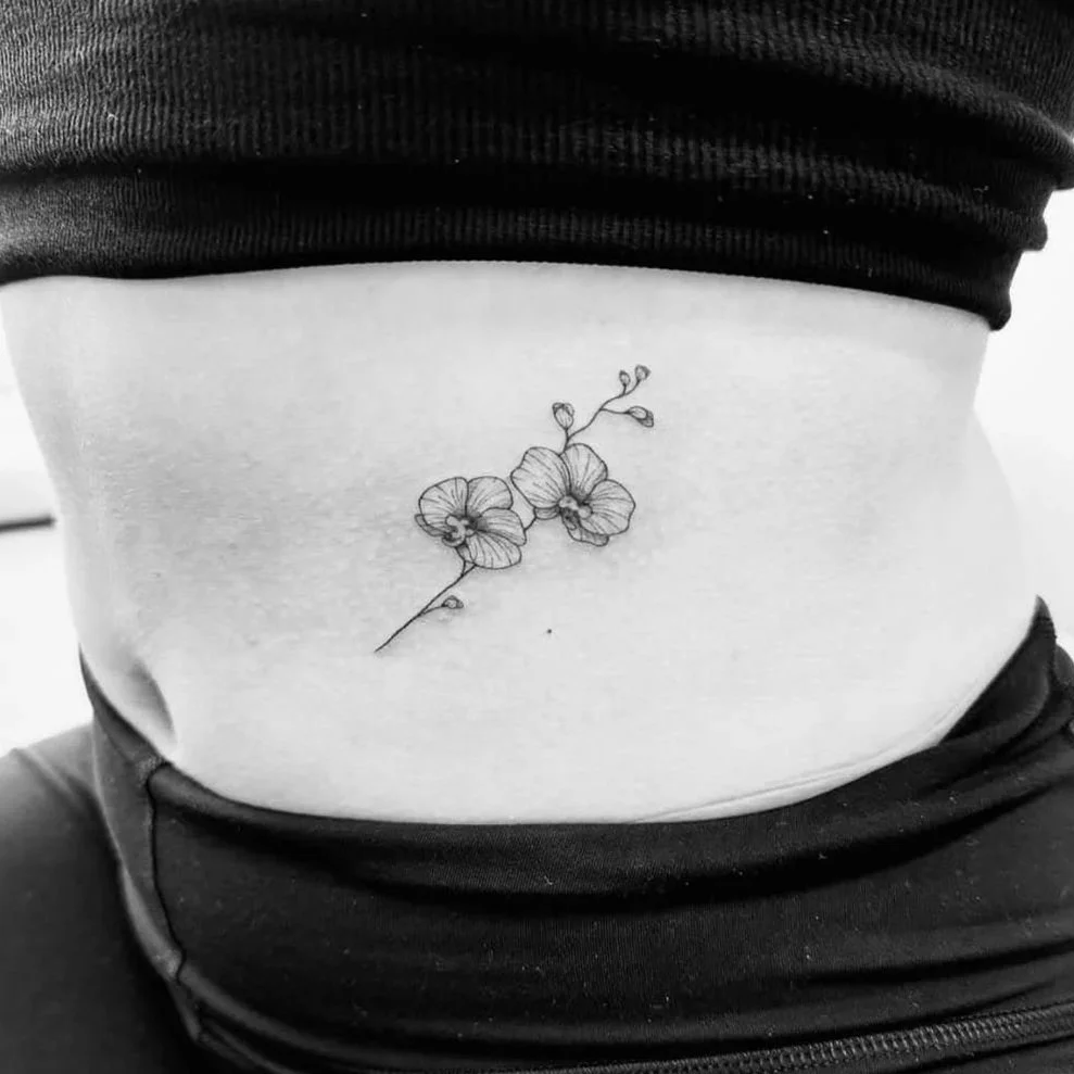 Fine Line Tattoo - floral rib tattoo