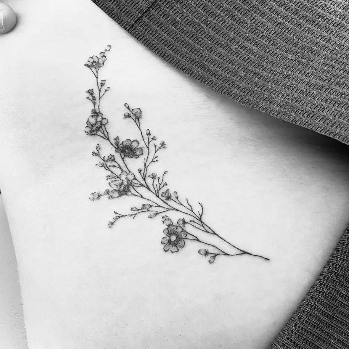 Fine Line Tattoo - delicate floral hip tattoo