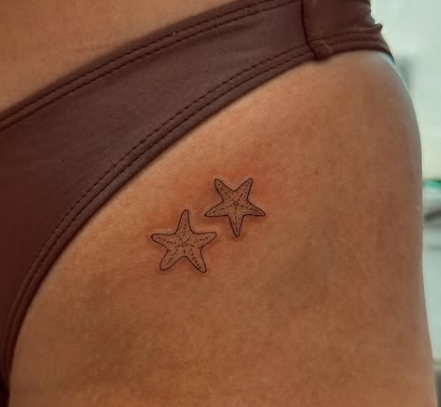 Fine Line Tattoo - tiny starfish hip tattoo
