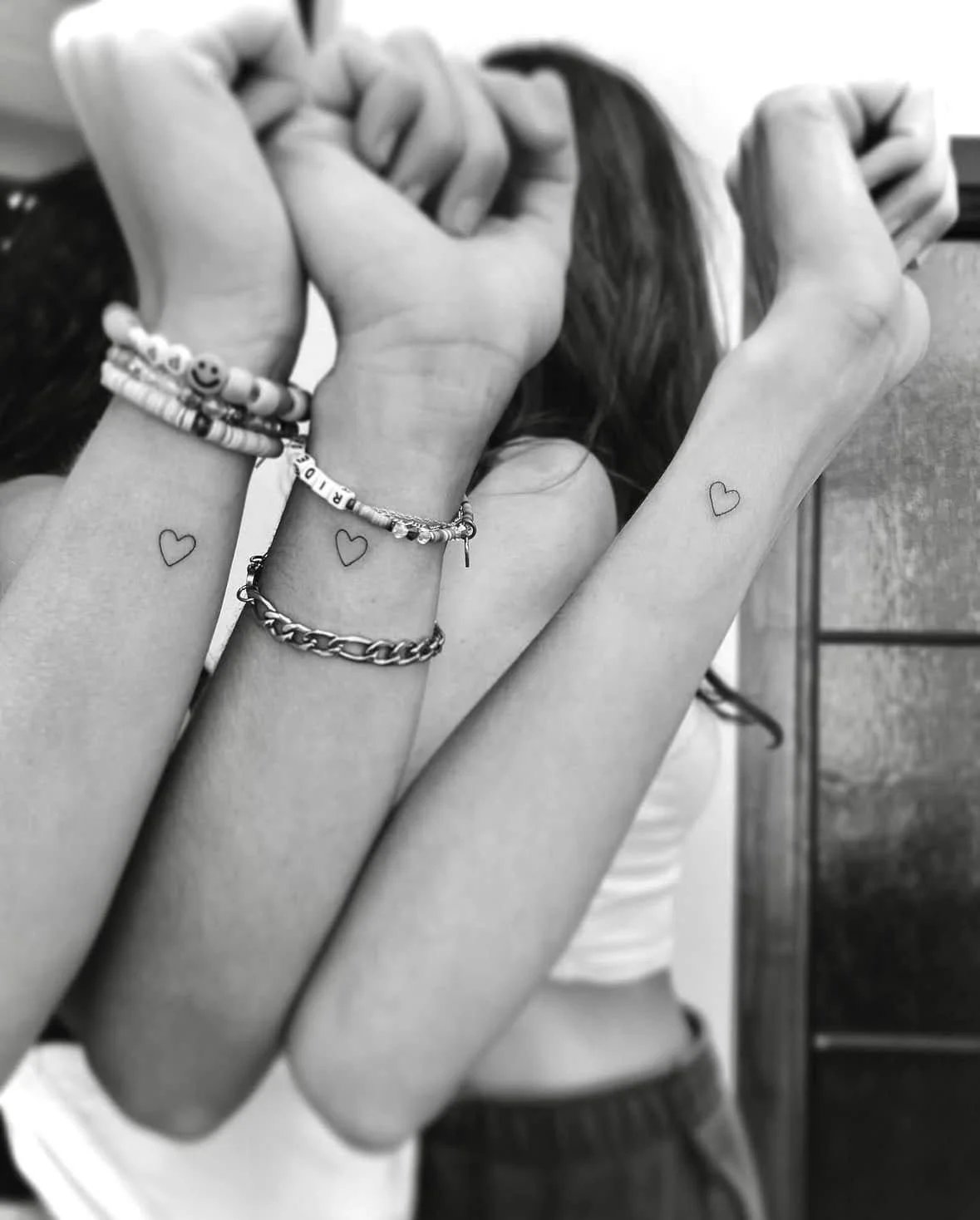 Fine Line Tattoo - tiny heart best friends tattoos