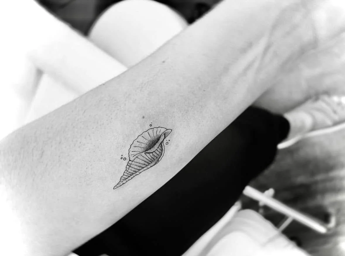 Fine Line Tattoo - tiny seashell tattoo