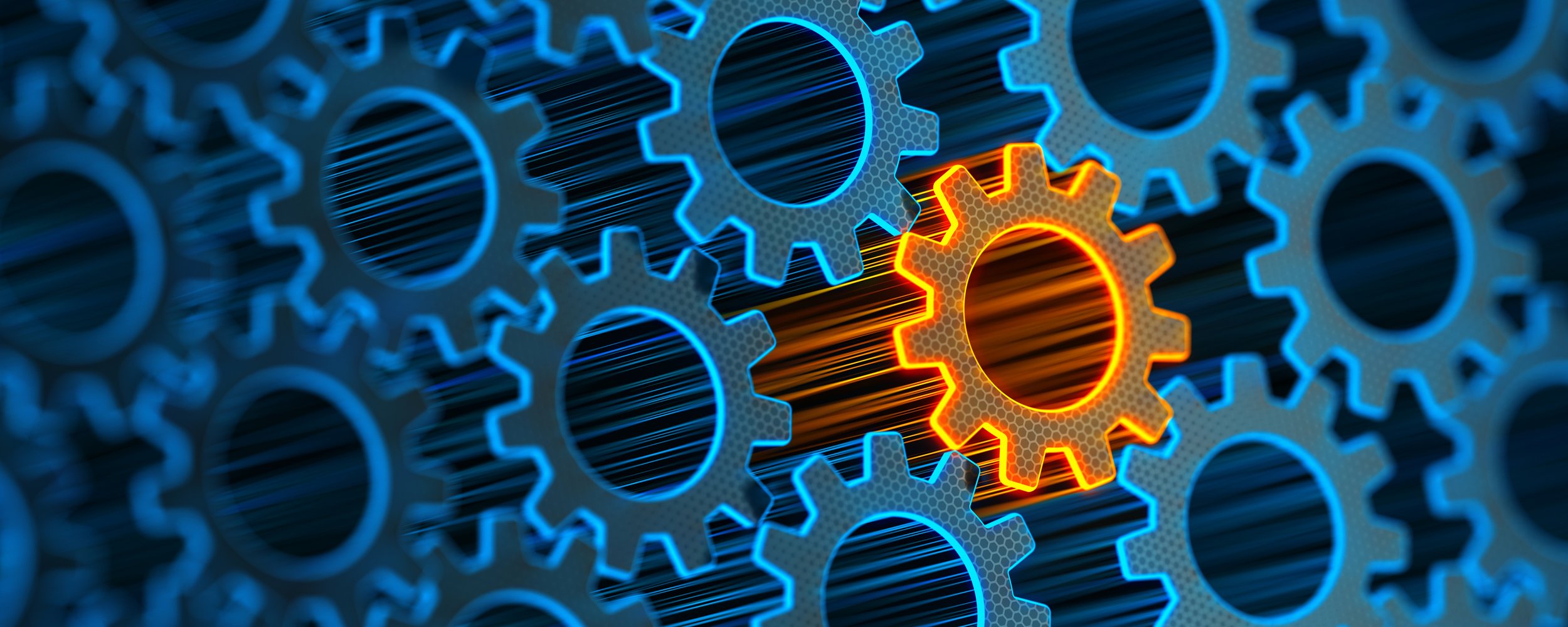 Close-up of interconnected gears with one gear highlighted in orange representing the organizational development services offered by center point.