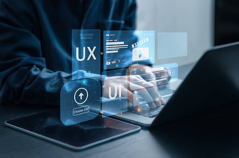Person using a laptop with digital UX and UI interface overlays