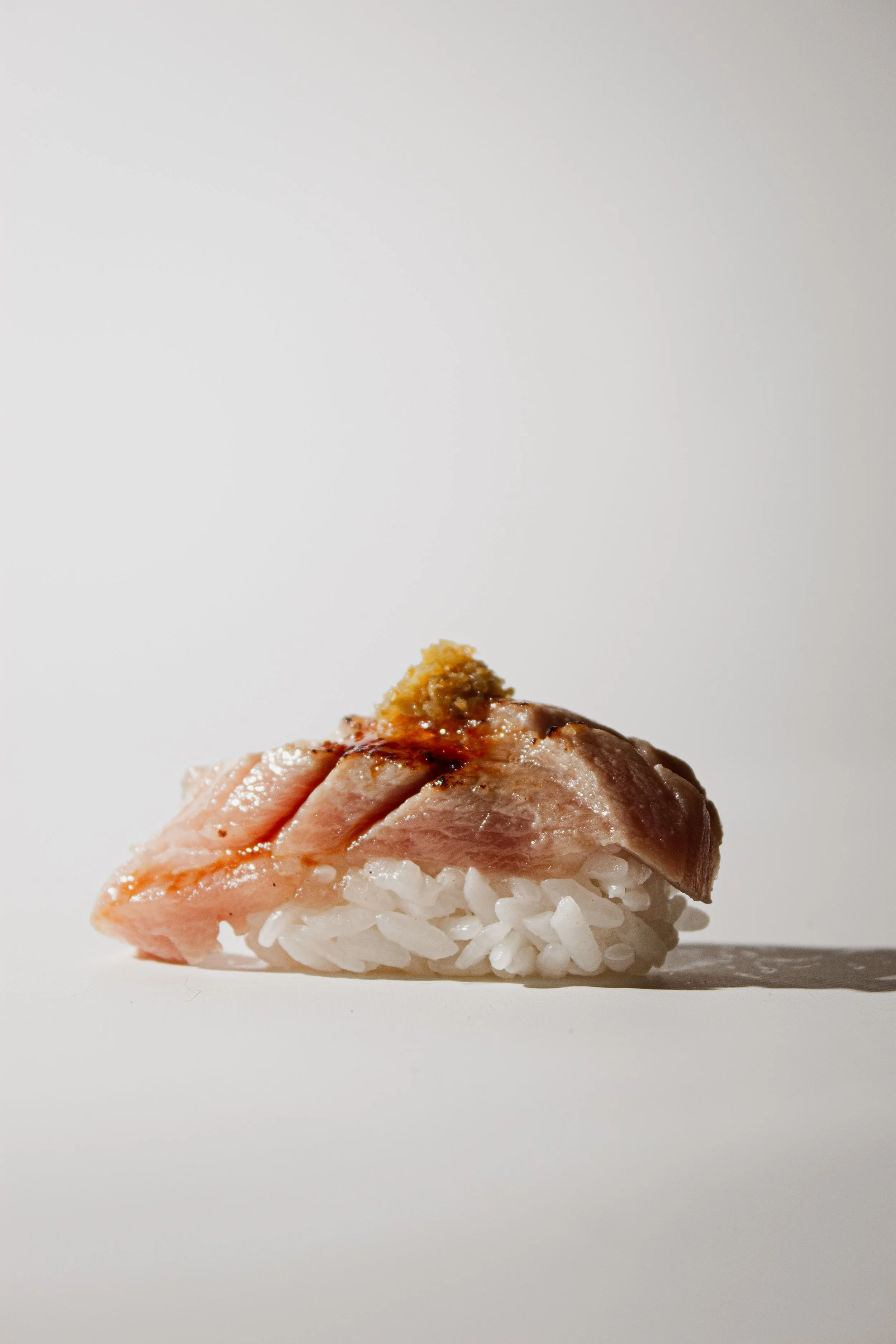 Bluefin otoro nigiri with lightly torched fatty tuna and yuzu kosho at REMU Tulum.