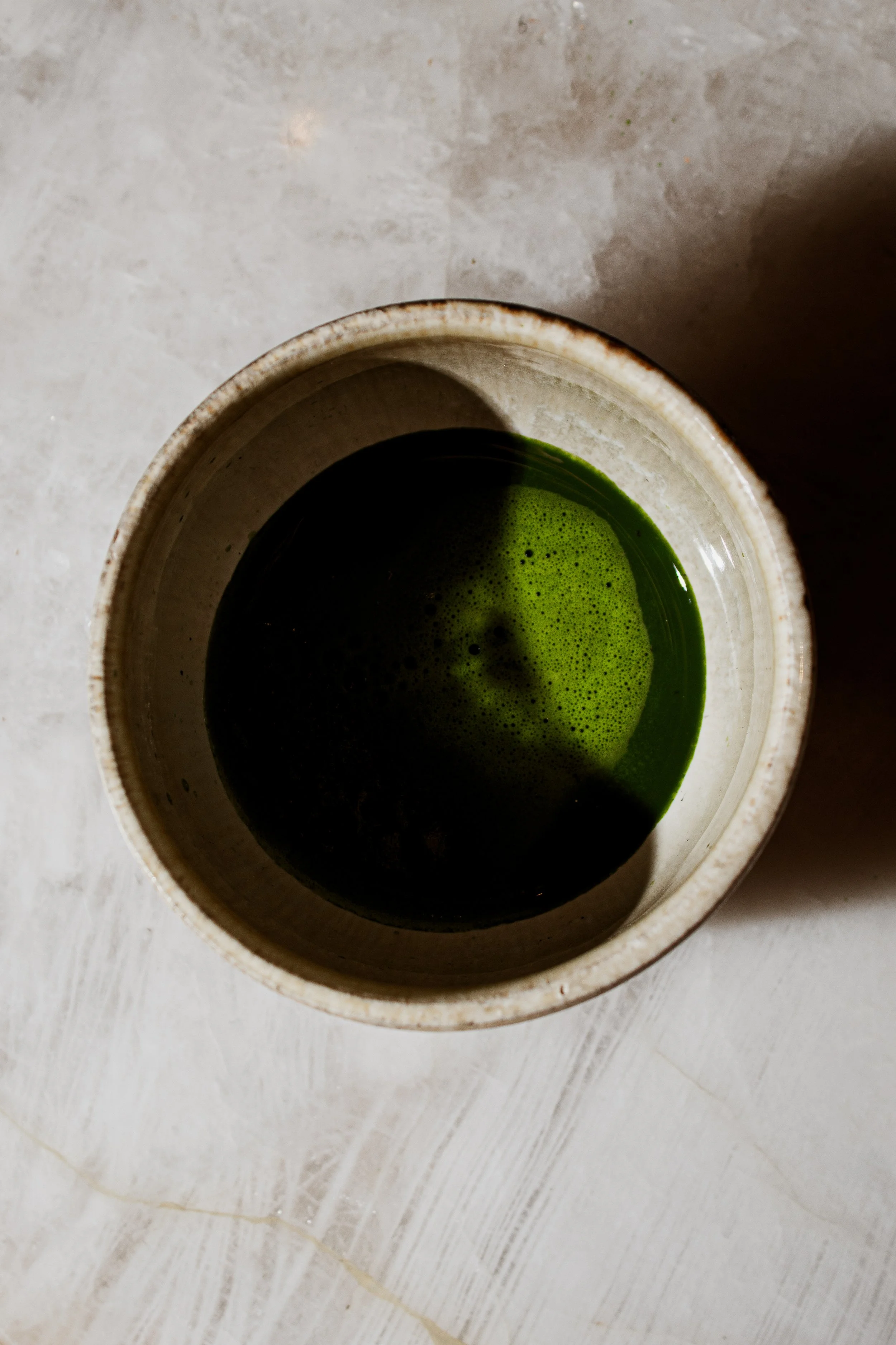 Ceremonial matcha served in a handcrafted ceramic bowl at REMU Tulum.