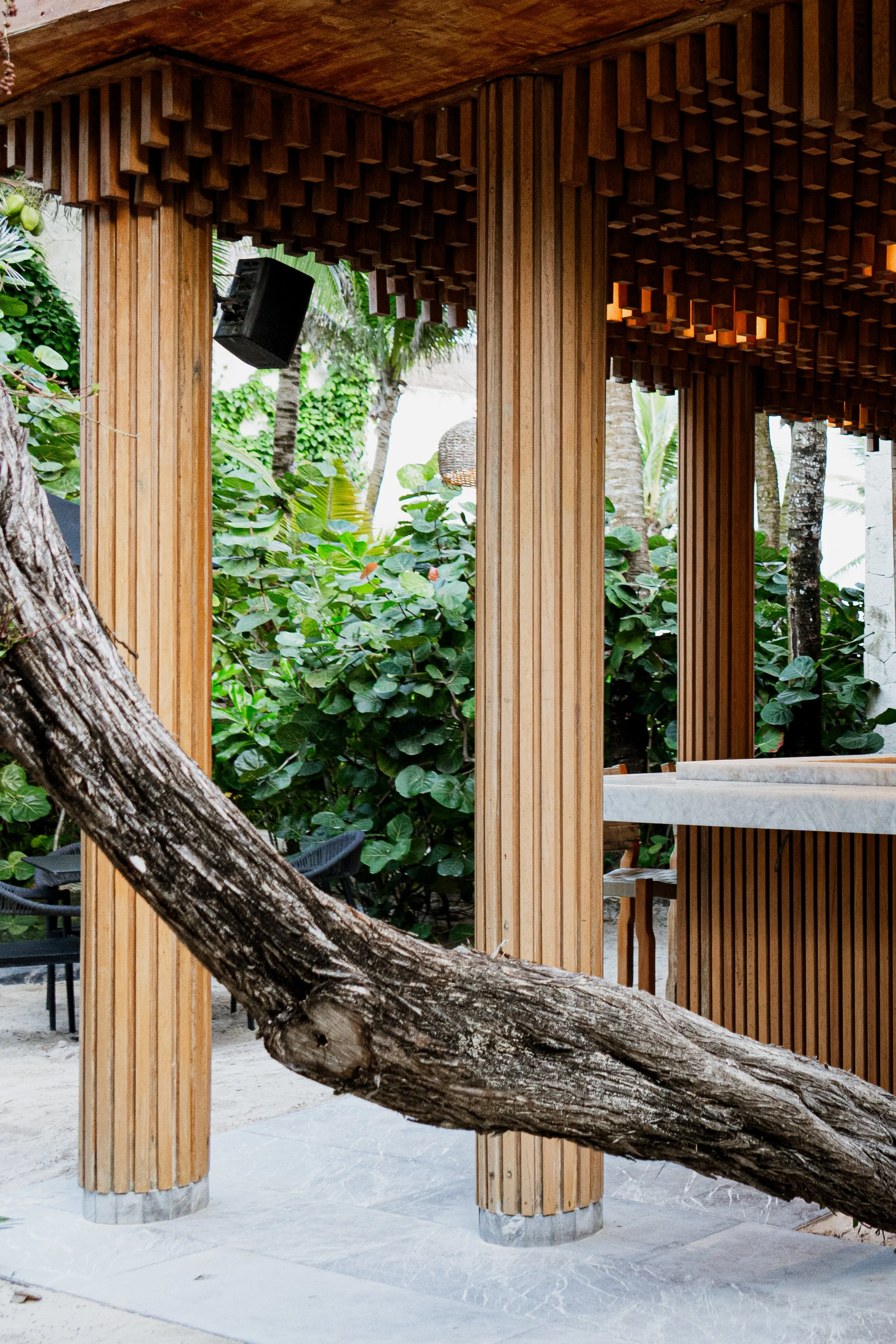 Contemporary  architecture at REMU Tulum, blending natural wood, jungle surroundings, and minimalist design.