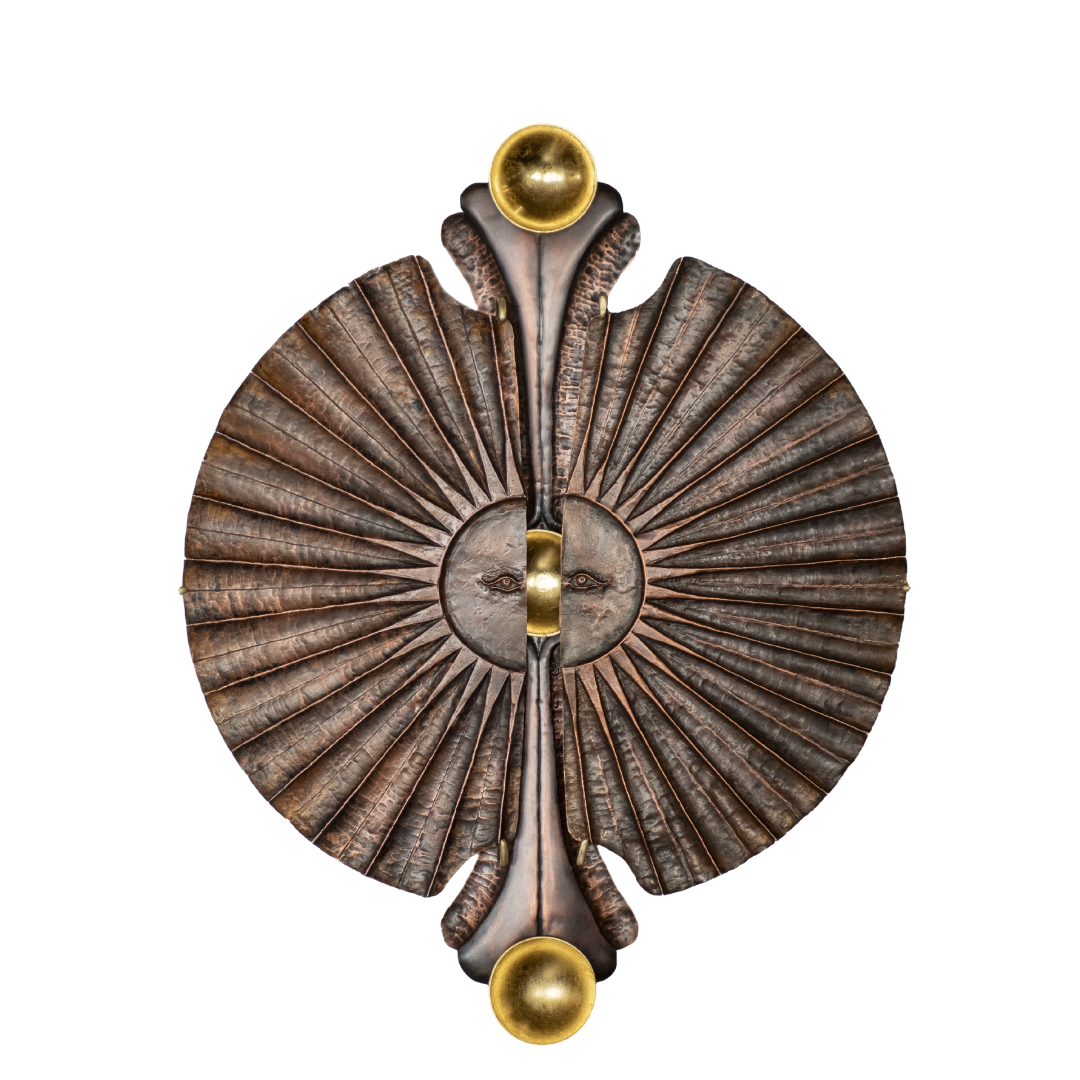 Metal Sun sculpture representing astrocartography or astrology session offering