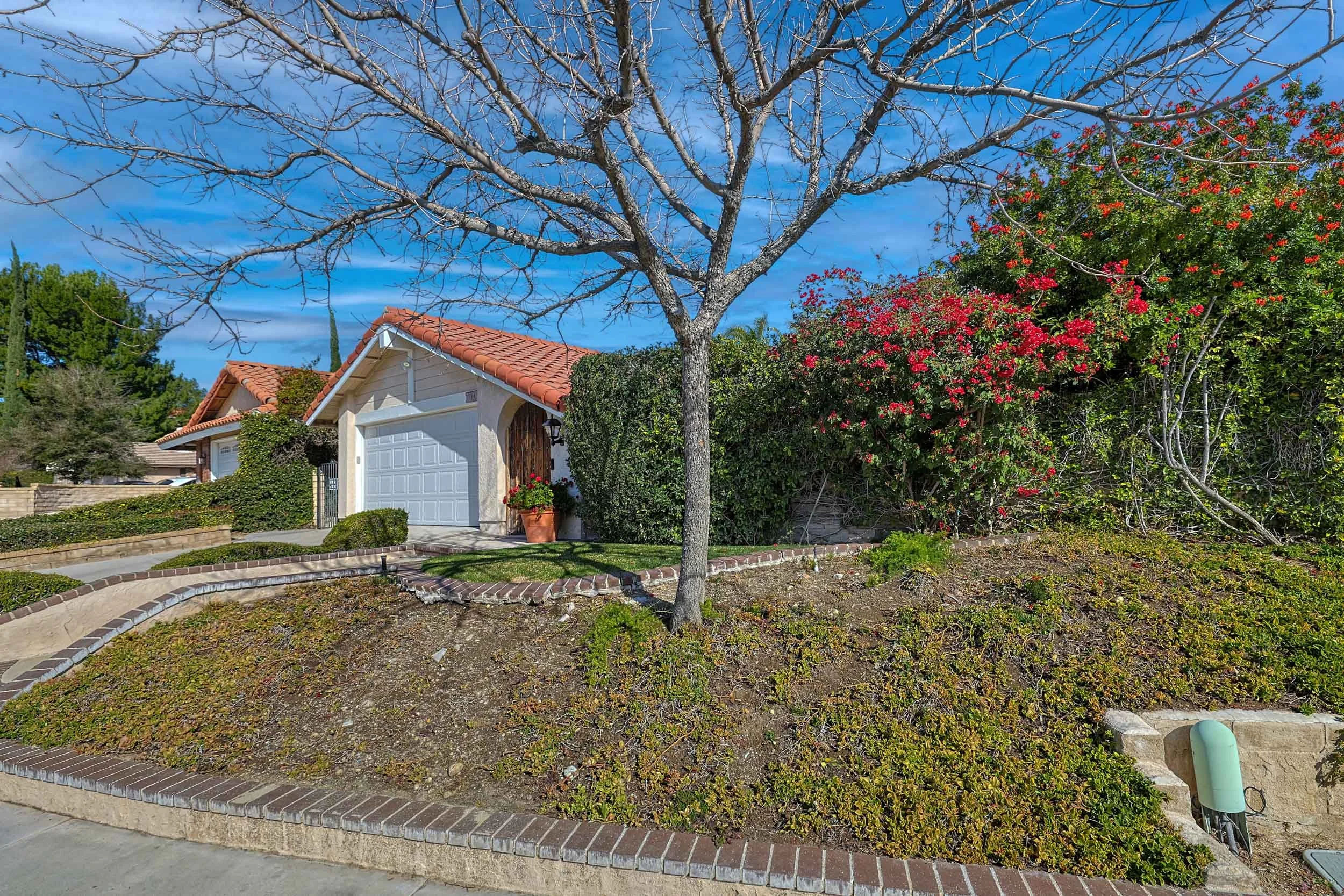 Professional real estate photo of single-family home at 17141 Nevette Court, Santa Clarita, CA 91387 — backyard pool, spa, and built-in barbecue with mountain views.