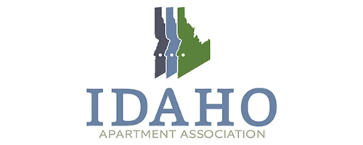 Logo of Idaho Apartment Association, featuring three layered silhouettes of the state of Idaho in shades of blue and green above the prominent text 'IDAHO' and 'APARTMENT ASSOCIATION'.
