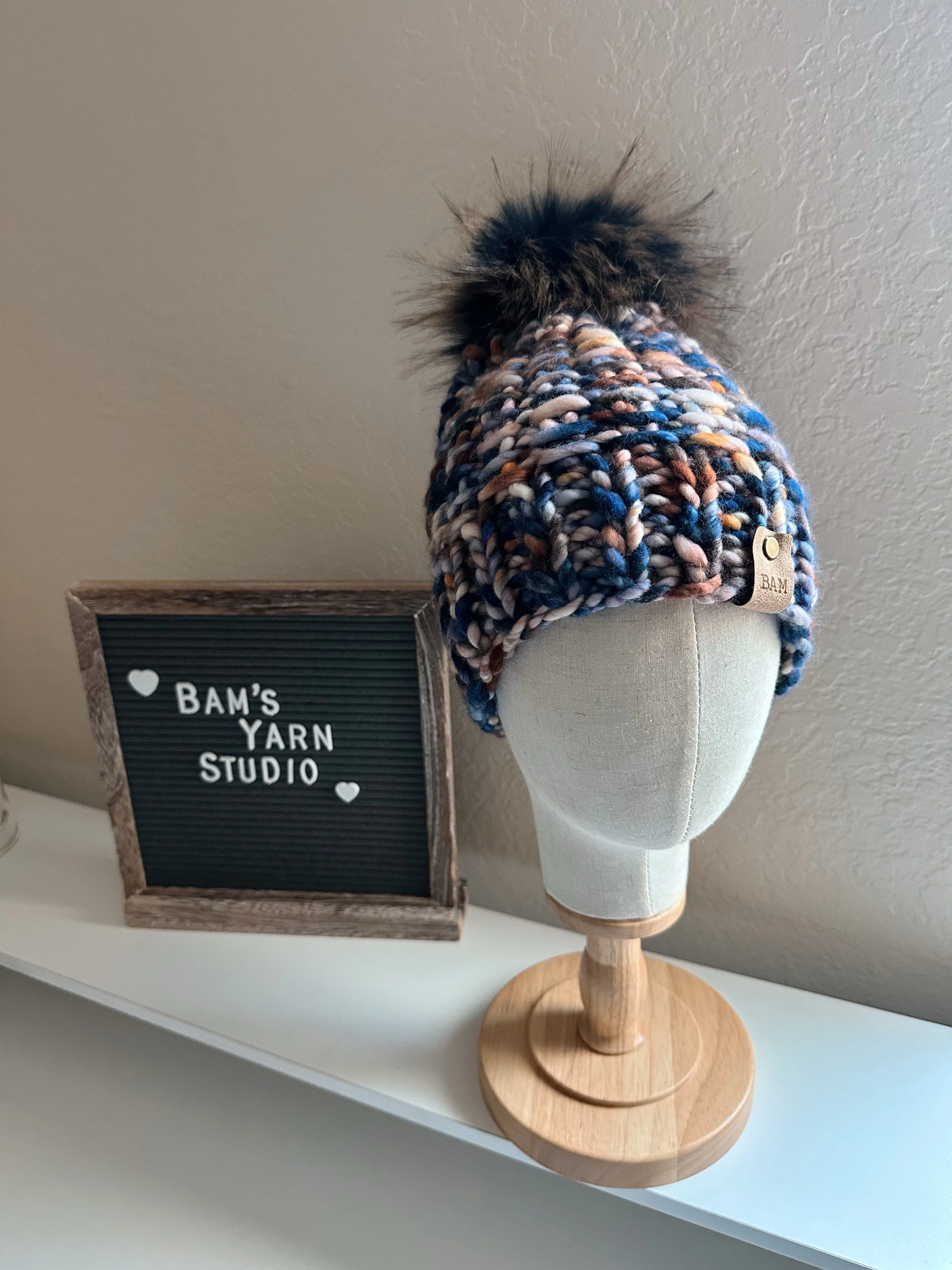This beauty is up on my website and is the coziest thing you&rsquo;ll ever touch. 😆 The Arlo Beanie knit with Malabrigo Rasta and a fun faux fur pom. Winter will be here before you know it! 

Shop on bamsyarnstudio.com link in my bio! 

#bamsyarnstu