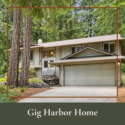 A two-story suburban house with a front porch, surrounded by tall pine trees and a well-maintained yard, labeled 'Gig Harbor Home'.