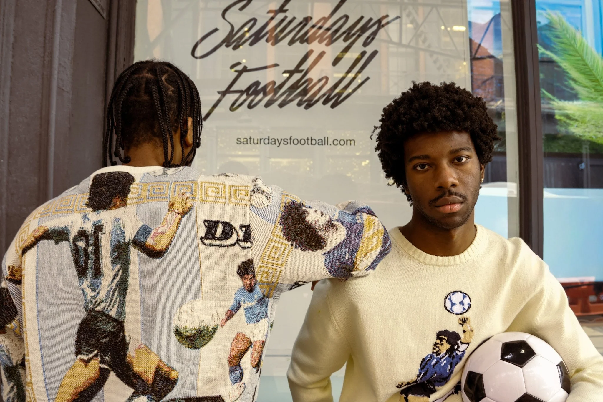two-men-outside-saturdays-football-storefront.jpg